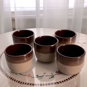 Five vintage tea cups.